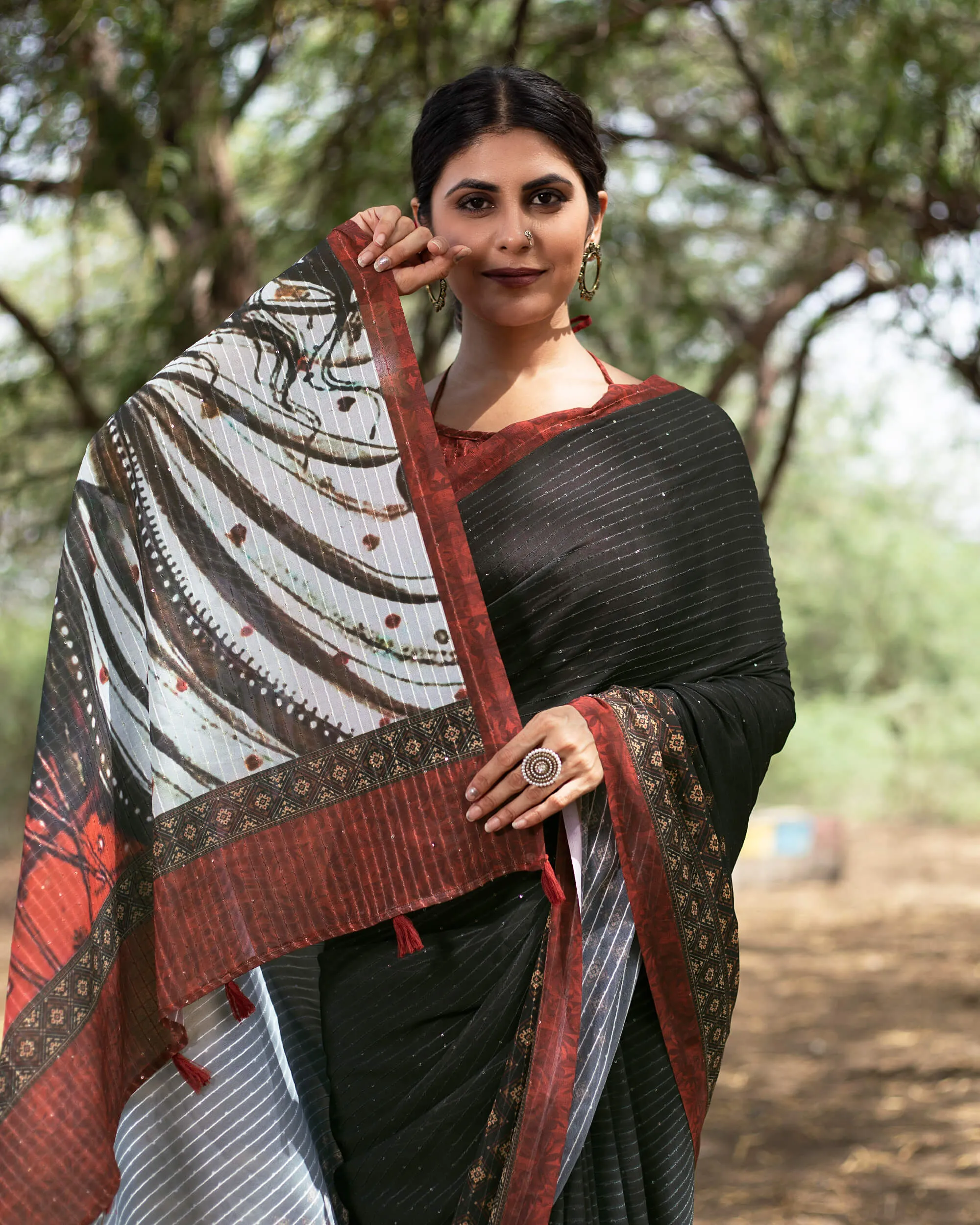 Black And Brick Red Quirky Pattern Premium Sequins Georgette Saree With Tassels