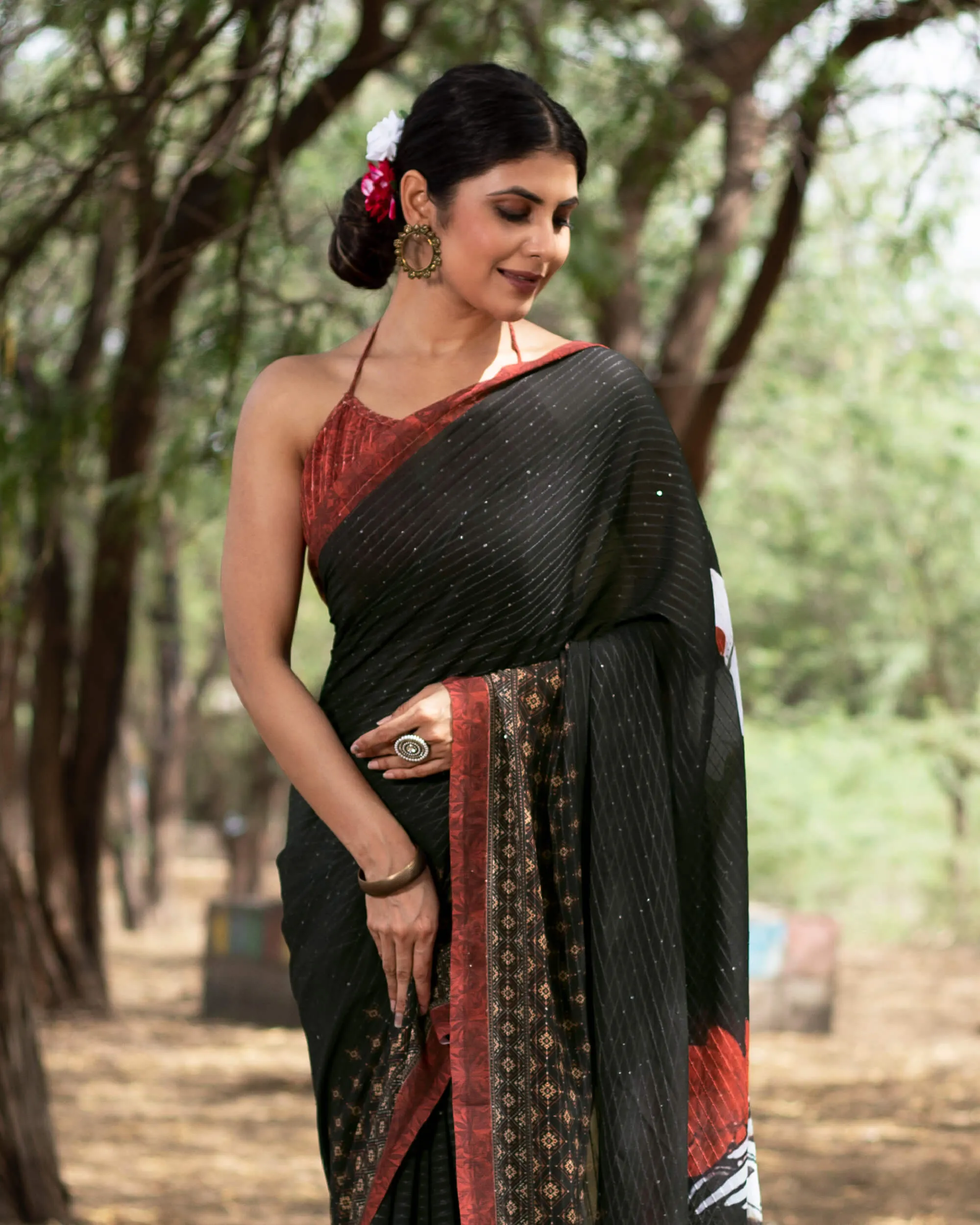 Black And Brick Red Quirky Pattern Premium Sequins Georgette Saree With Tassels